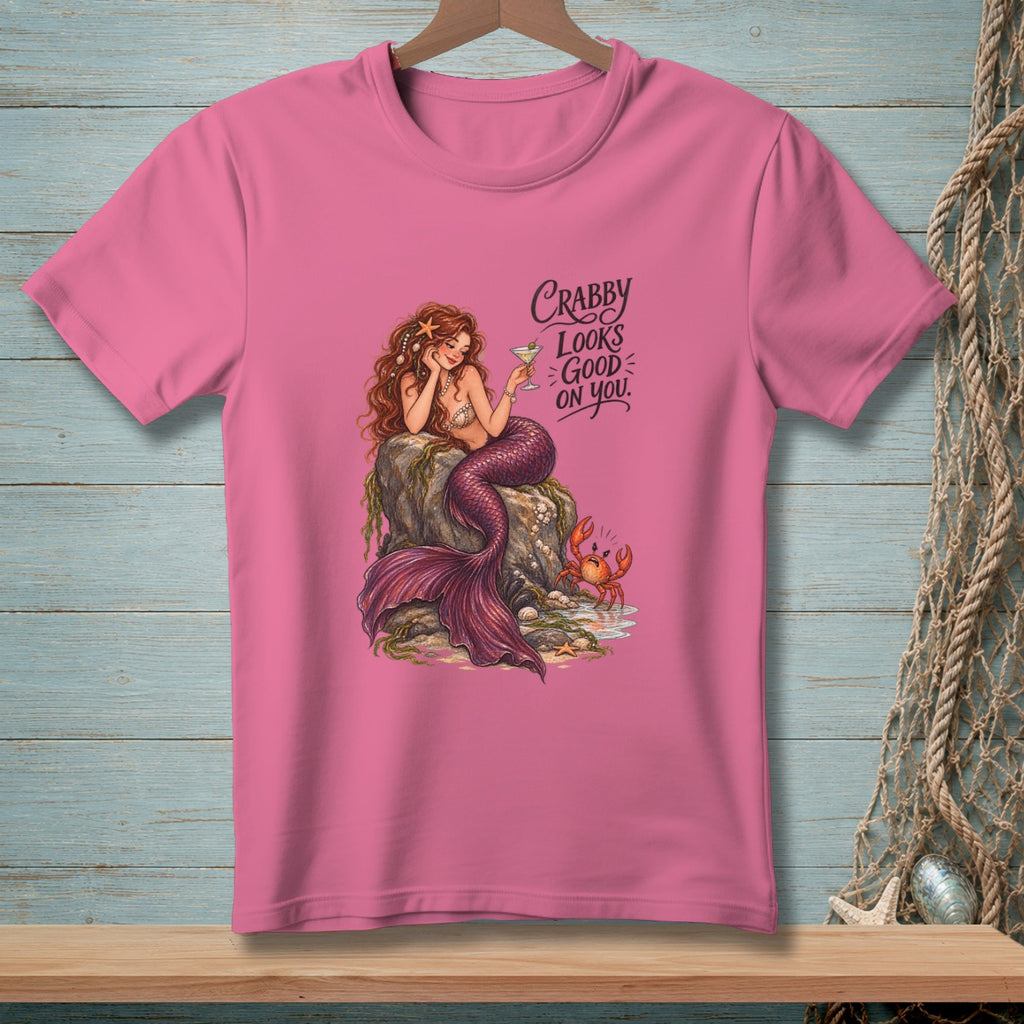 Pink t-shirt with a mermaid, crab, and text "Crabby Looks Good On You."