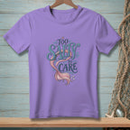 Purple t-shirt with "Too Salty To Care" text and mermaid tail graphic.