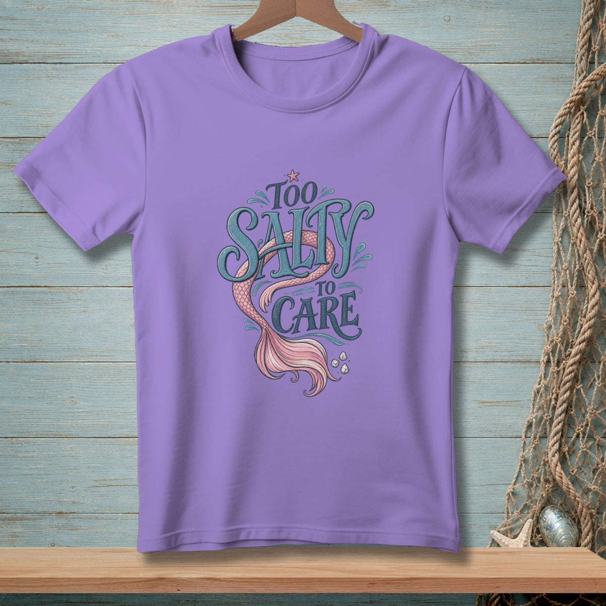 Purple t-shirt with "Too Salty To Care" text and mermaid tail graphic.