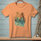 Two mermaids with blue tails drink from wine bottles on a dock.