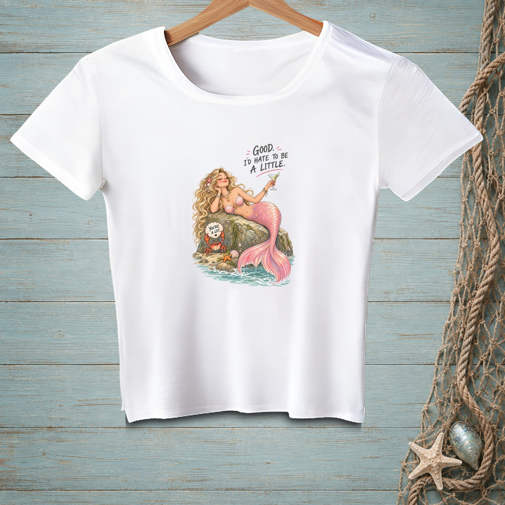 White t-shirt with a pink mermaid on a rock, holding a drink and a crab with text.