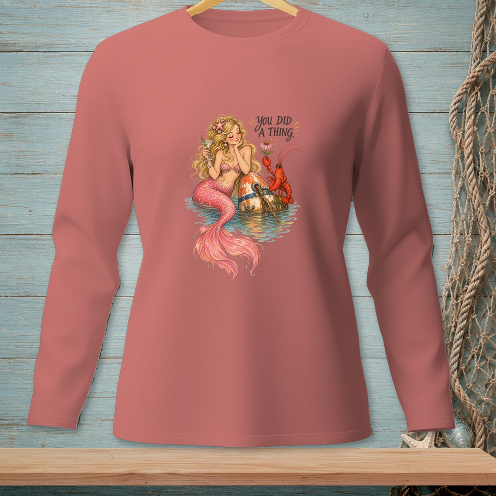 Mermaid holding a drink next to a lobster and buoy, with text "You did a thing."