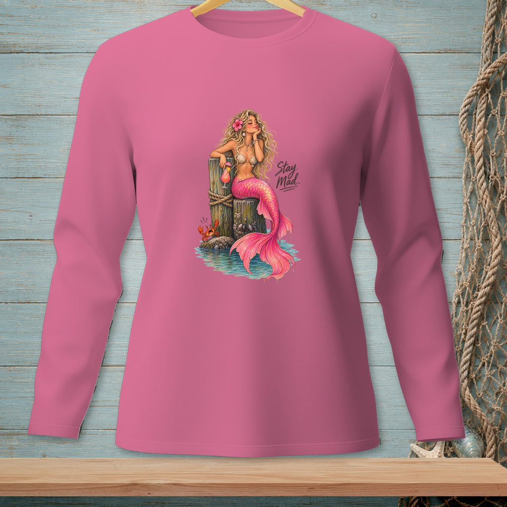 Pink long sleeve shirt with a graphic of a mermaid holding a drink and text "Stay Mad."