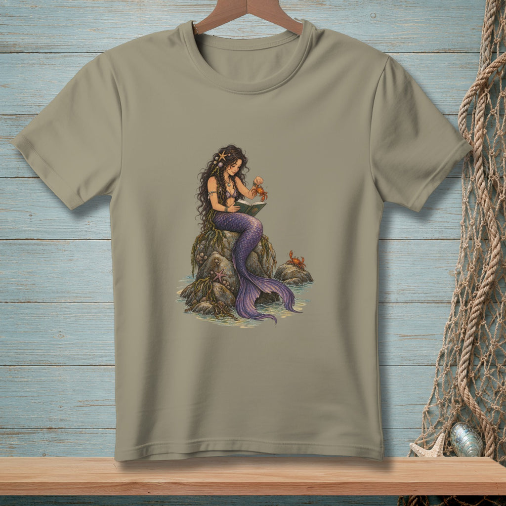 Illustration of a mermaid reading a book to a crab on a rock.