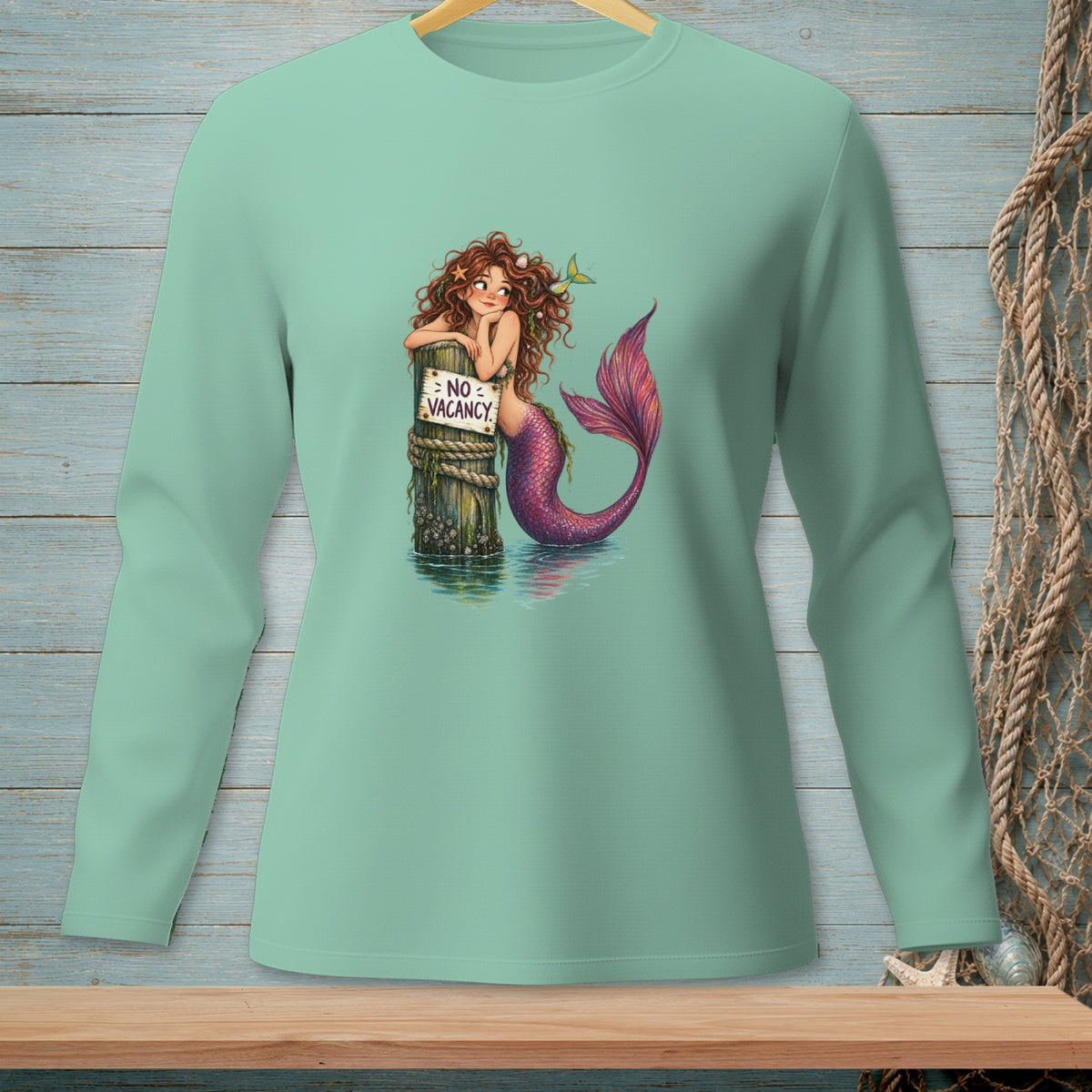 Mermaid leaning on post with "NO VACANCY" sign, purple tail.