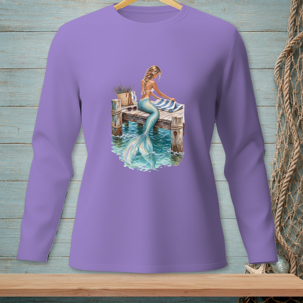 Long sleeve lilac shirt with a graphic of a mermaid sitting on a dock.
