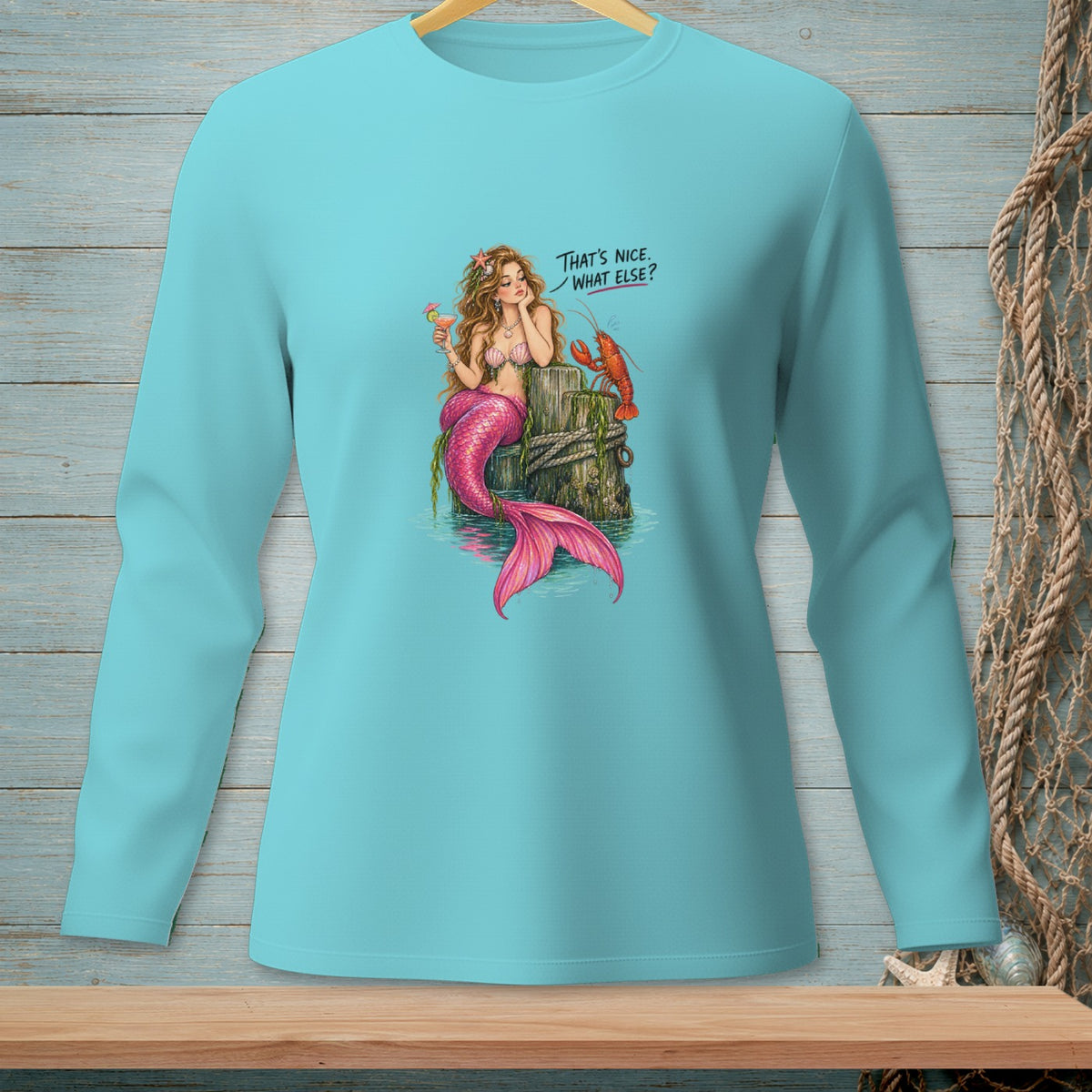 Mermaid with pink tail and drink talks to a lobster; text says "That's nice. What else?"