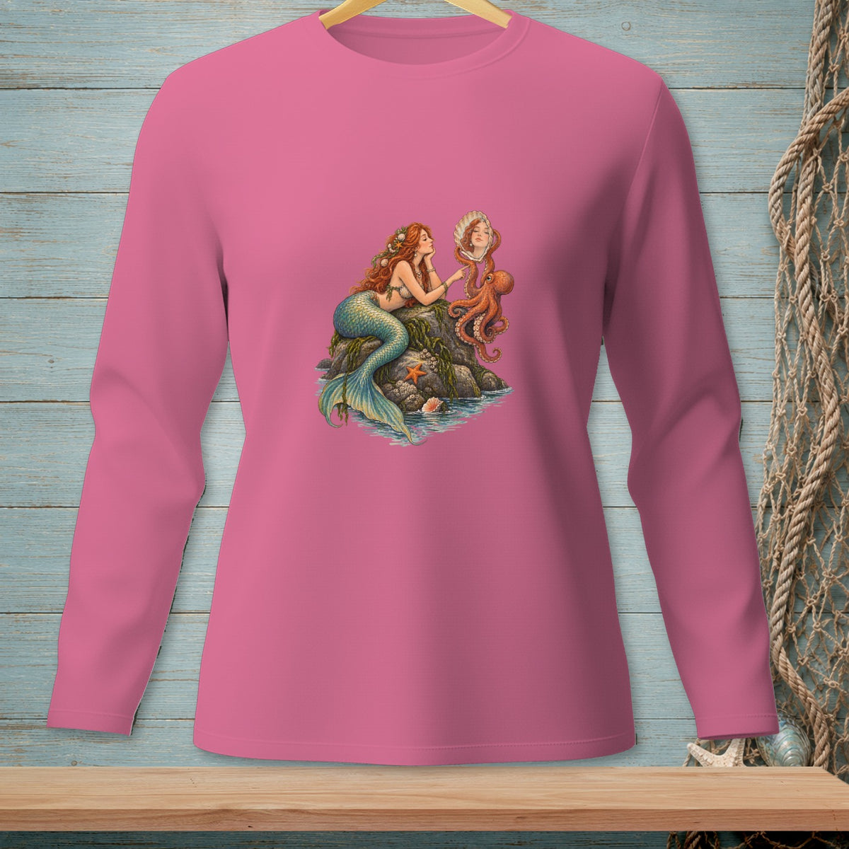 Pink long-sleeve shirt with a mermaid and octopus graphic.
