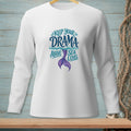 White long-sleeved shirt with "KEEP YOUR DRAMA ABOVE SEA LEVEL" text and mermaid tail graphic.