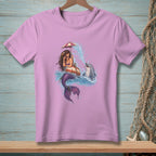 Mermaid with umbrella and dolphin in ocean splash on pink t-shirt.