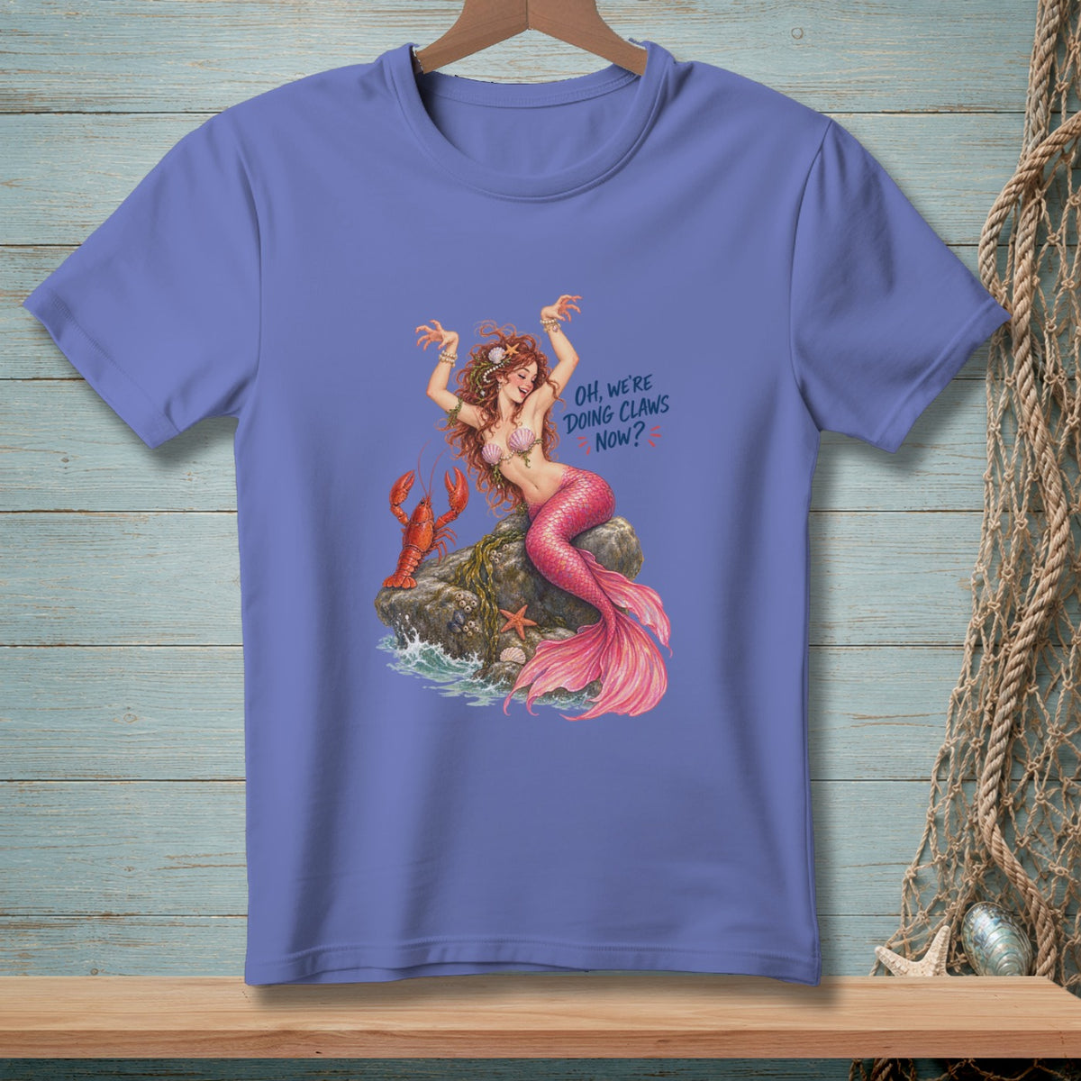Mermaid with lobster and text "OH, WE'RE DOING CLAWS NOW?".