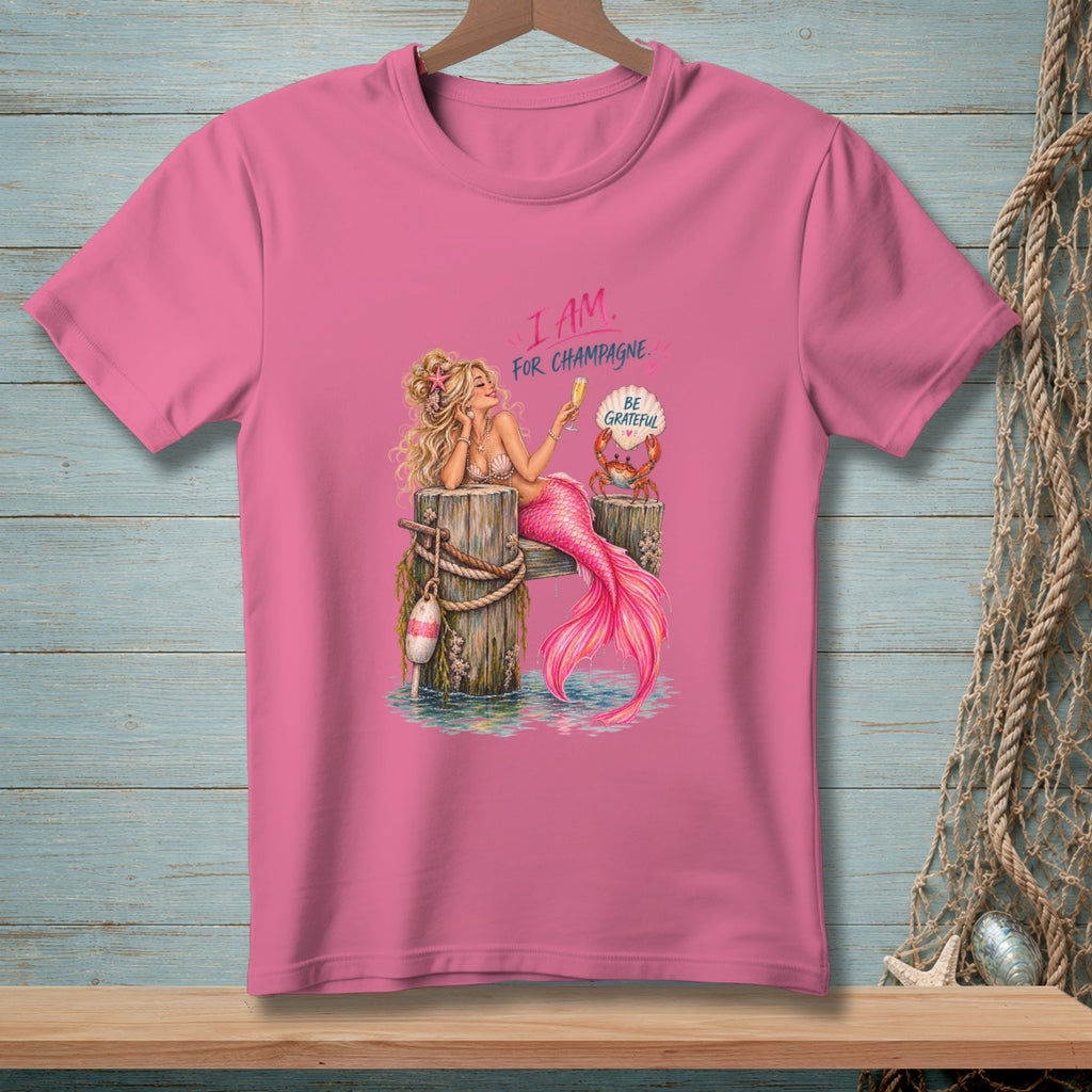 Pink t-shirt with mermaid holding champagne and text "I AM. FOR CHAMPAGNE. BE GRATEFUL."