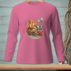Pink long-sleeve shirt with a mermaid, lobster, and seashells illustration.