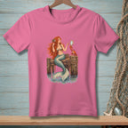 Pink t-shirt with a mermaid and crab on a dock illustration.