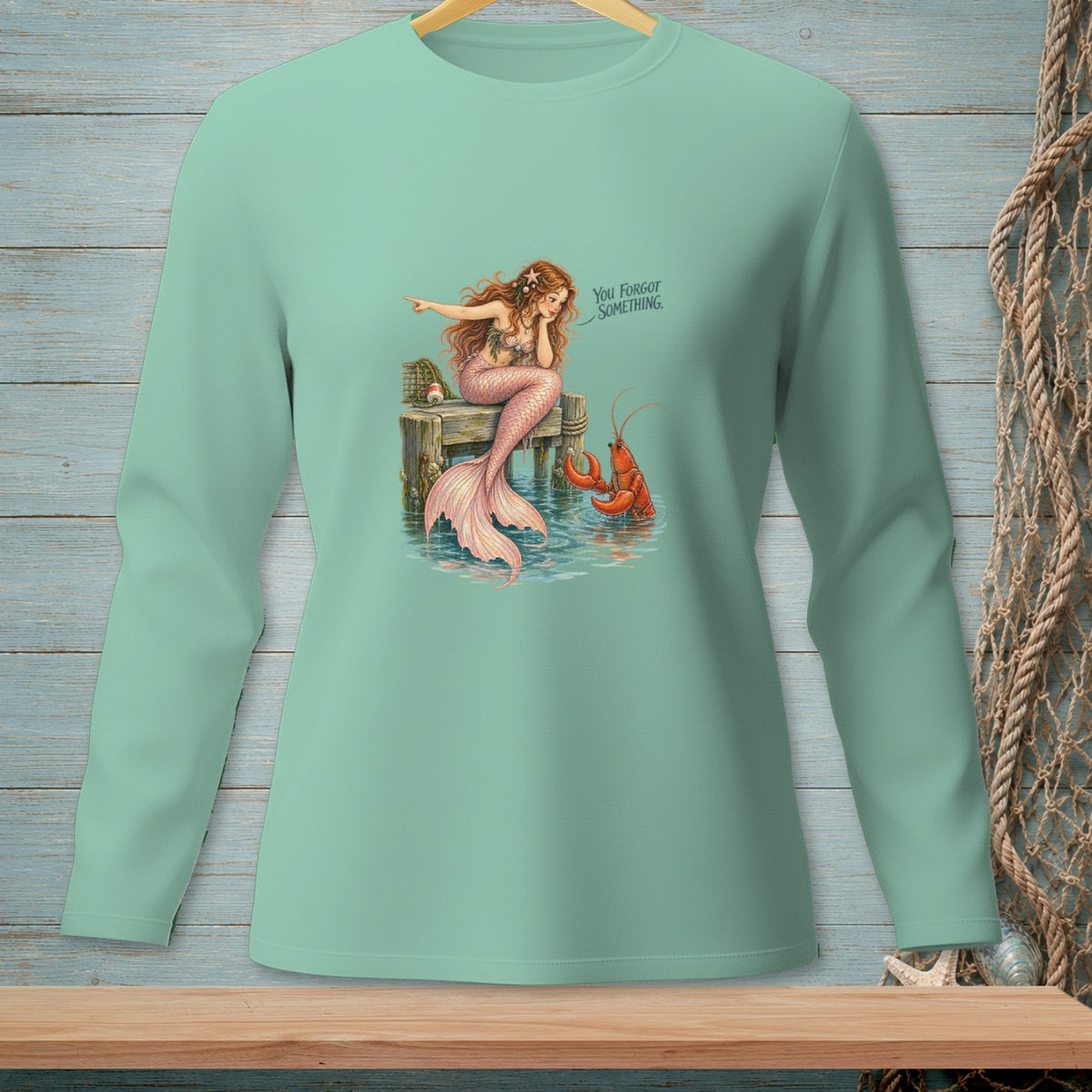 Mermaid pointing at lobster saying "You forgot something."