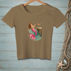 Mermaid fishing from a wooden dock with a hand reaching for bait.