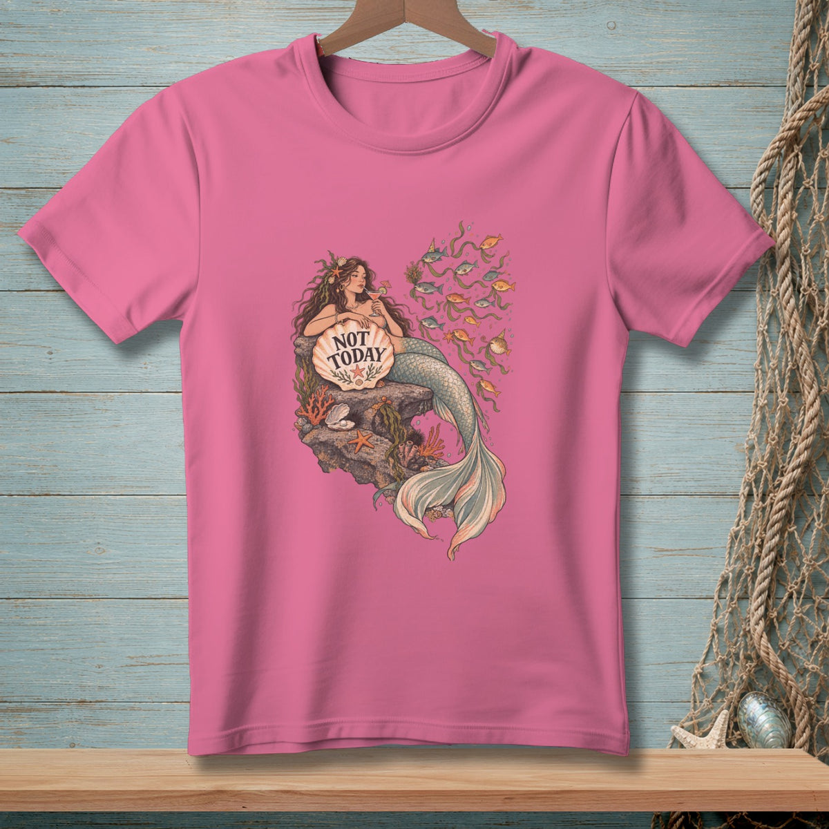 Pink t-shirt with mermaid graphic saying "NOT TODAY" on a seashell.