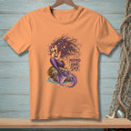 Peach t-shirt with a mermaid illustration holding a coffee cup, text reads "MERMAID HAIR DAY".