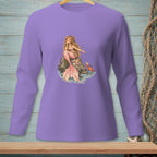 Lavender long-sleeve shirt with a mermaid illustration on a rock next to a crab.