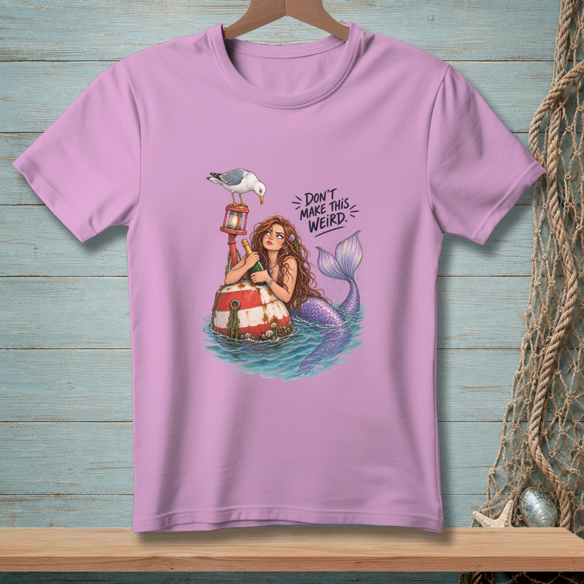 Mermaid with a bottle on a buoy, with a seagull and text "DON'T MAKE THIS WEIRD".