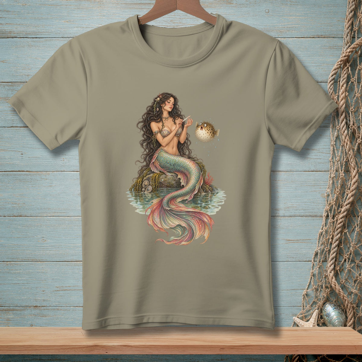 Illustration of mermaid sitting on a rock with a pufferfish.