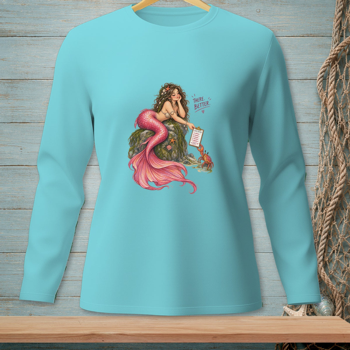 Turquoise long-sleeve shirt with a mermaid and crab design.