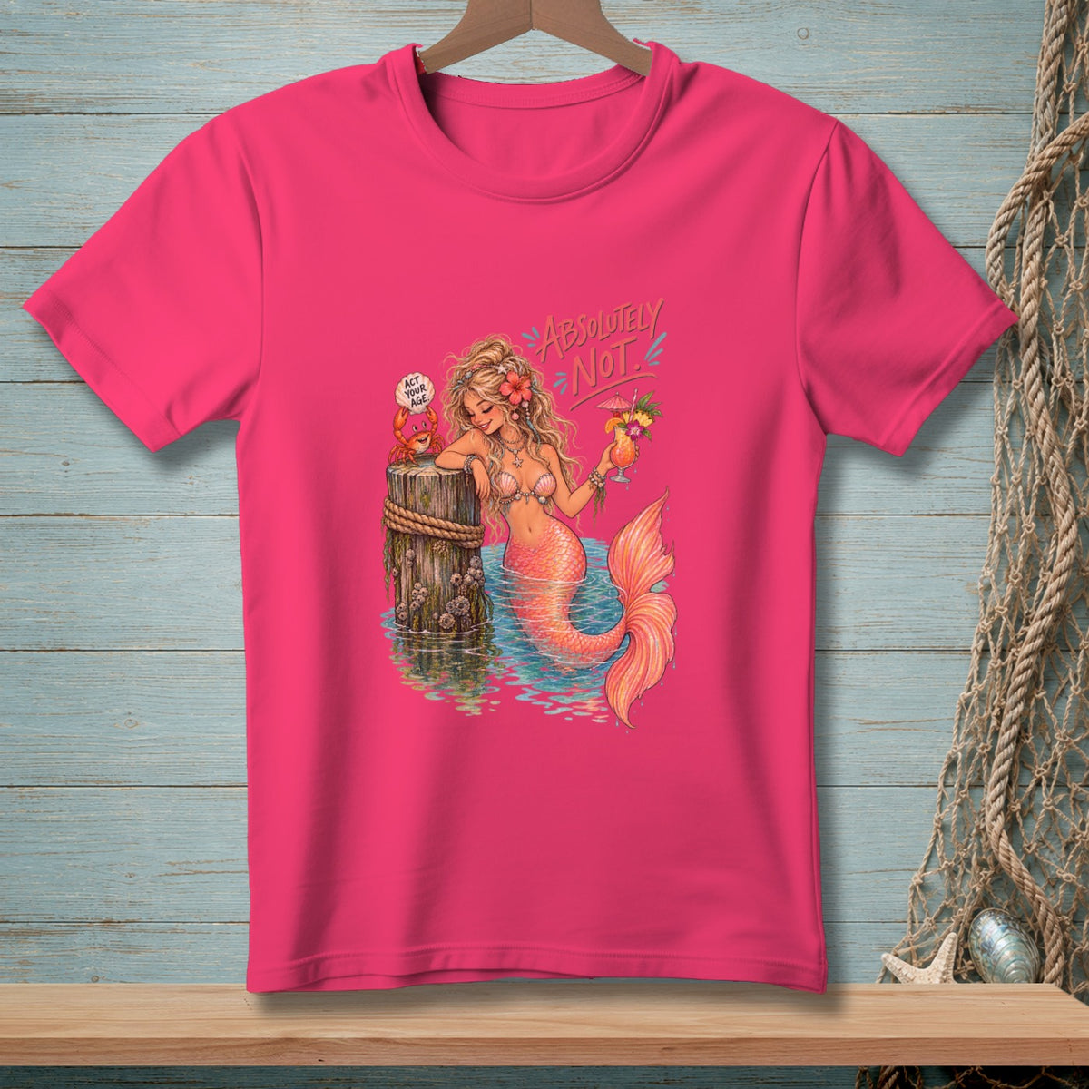 Pink t-shirt with mermaid, crab, and text "ABSOLUTELY NOT".