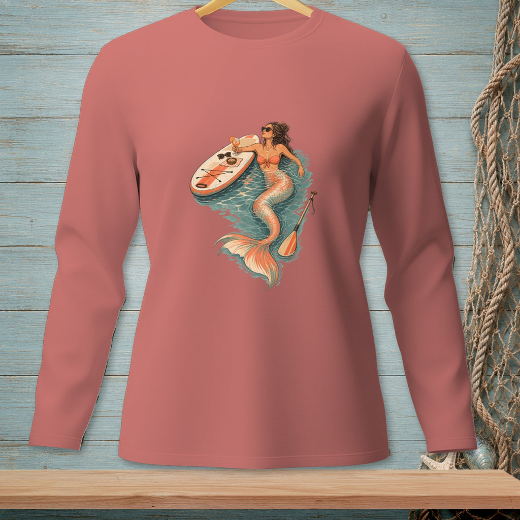 Mermaid with paddleboard and drink, graphic on a pink long-sleeve shirt.