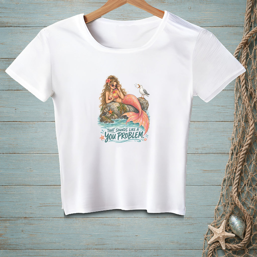 White t-shirt with a mermaid and seagull graphic that reads "That sounds like a you problem."