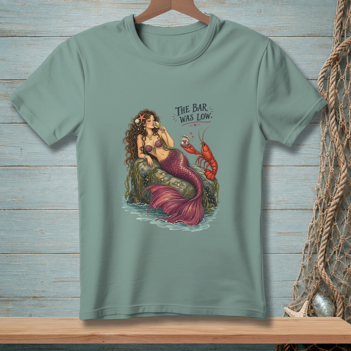 Mermaid and lobster illustration with text "The Bar Was Low."