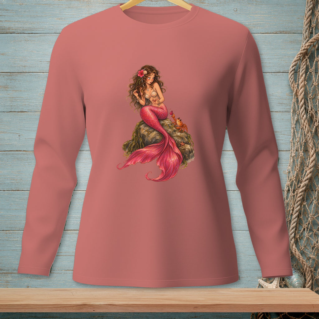 Pink long-sleeve shirt with a detailed mermaid and crab graphic on a rock.