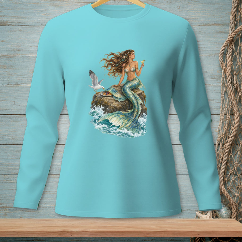 Teal long-sleeve shirt with a mermaid and seagull on a rock with waves.