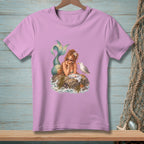 Pink t-shirt with a mermaid sitting on a rock with a seagull.