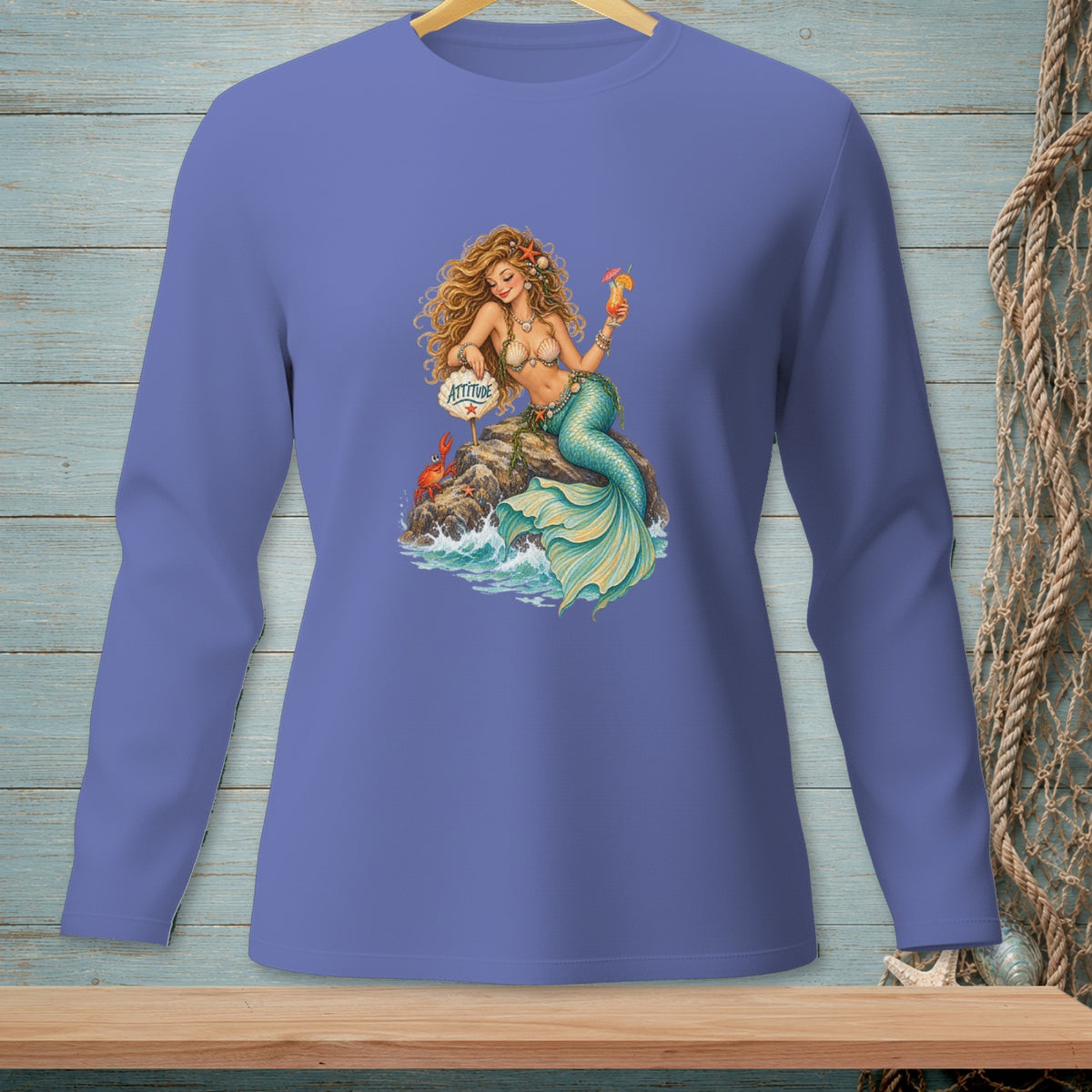 Mermaid with a drink and crab on a rock, holding a sign with "Attitude".