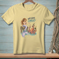 Light yellow t-shirt with a mermaid and octopus drinking champagne, asking "Why Create Conflict?"