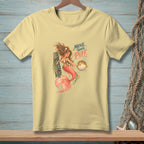 Light yellow t-shirt featuring a mermaid holding a pufferfish with text "Move Your Puff".