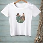 Three mermaids with colorful tails gathered in a circular body of water.