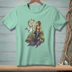 Mint t-shirt with illustration of a mermaid and seagull near a "Please Hold" sign.