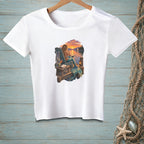 White t-shirt with a mermaid sitting on a dock at sunset.