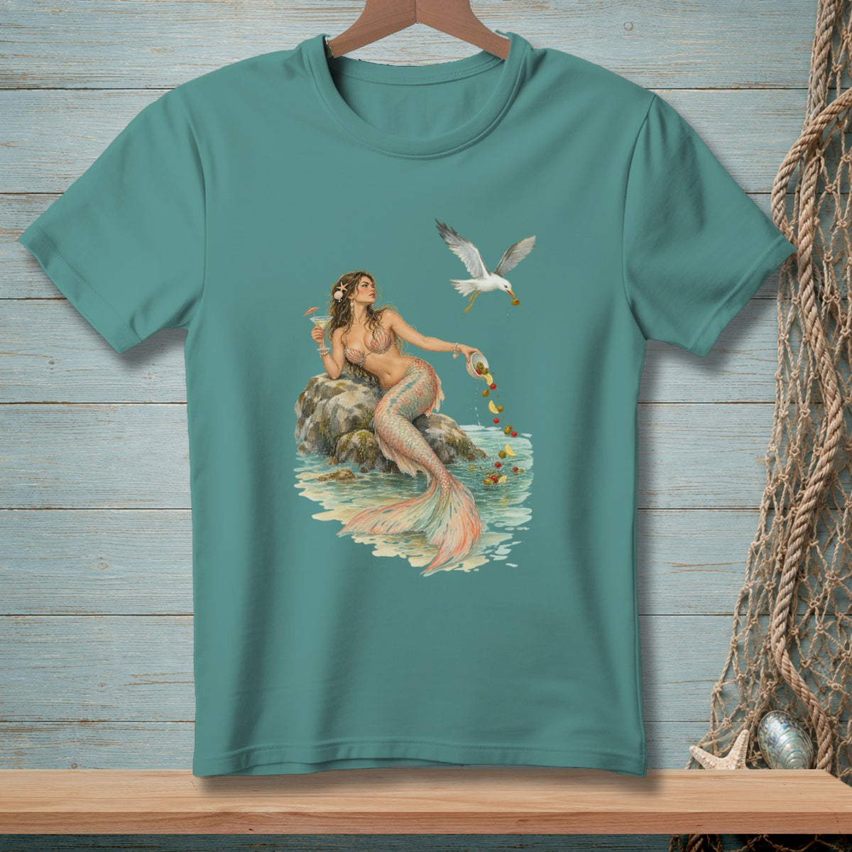 Mermaid on rock with cocktail and a seagull stealing olives from a bowl.