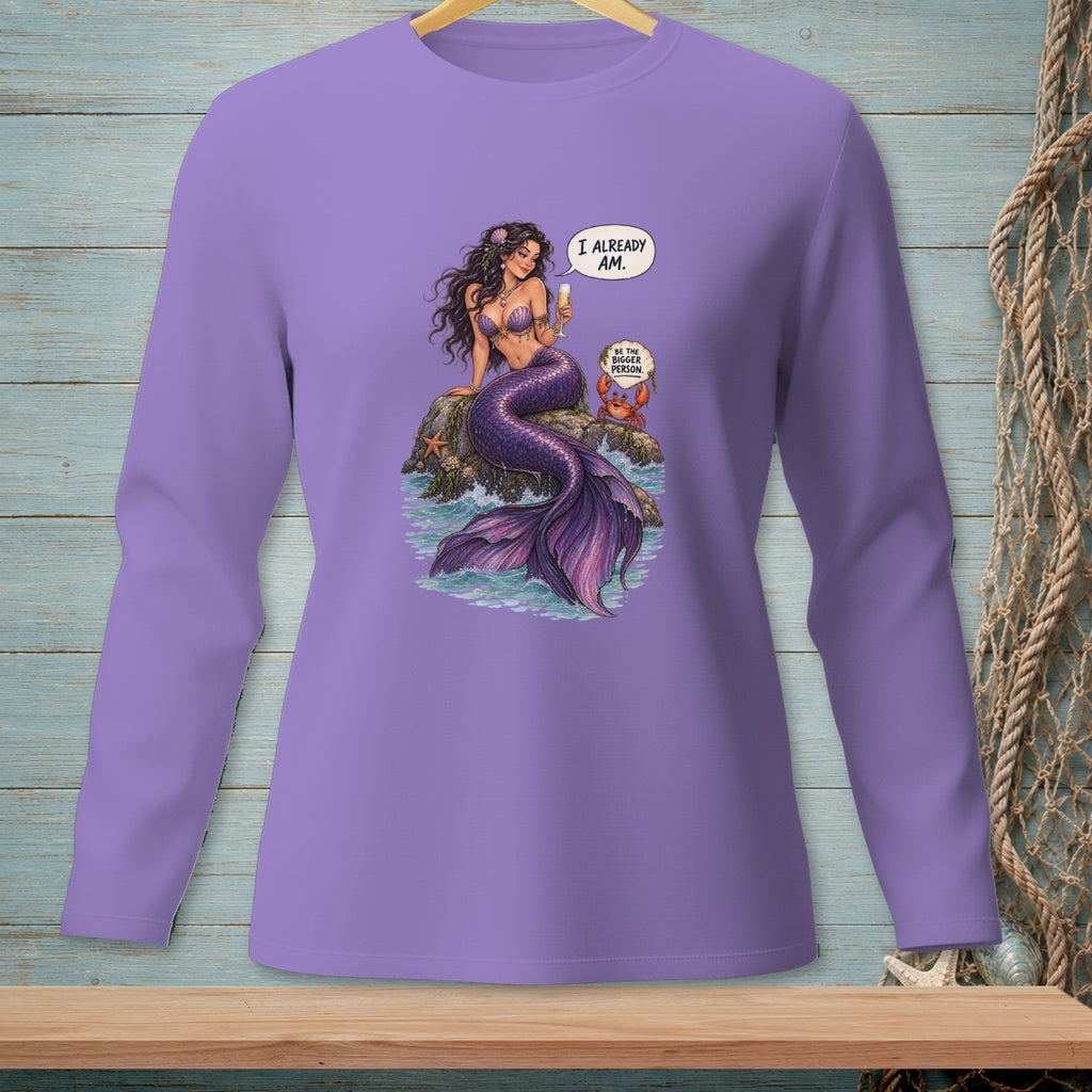 Purple long-sleeve shirt with mermaid saying "I already am" next to crab.