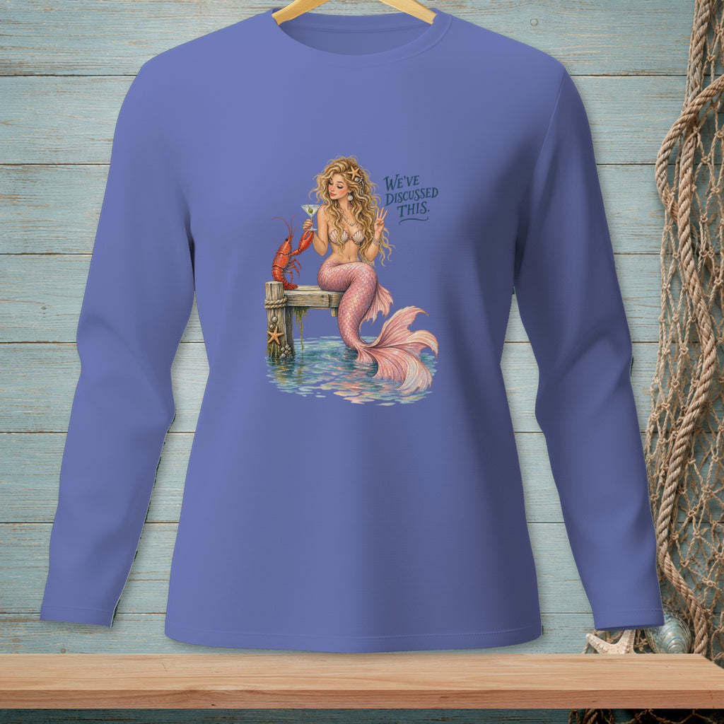 Mermaid with lobster and cocktail on dock, text "We've discussed this."