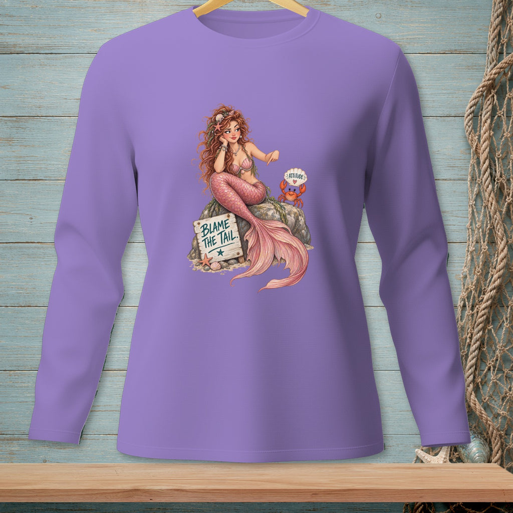 Mermaid with text "BLAME THE TAIL" and a crab on a rock, printed on a purple long-sleeve shirt.