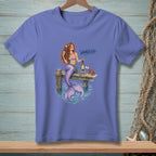 Mermaid on dock with wine and books, "Handled" text.