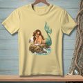 Mermaid and seagull sharing food on a rock in the ocean.