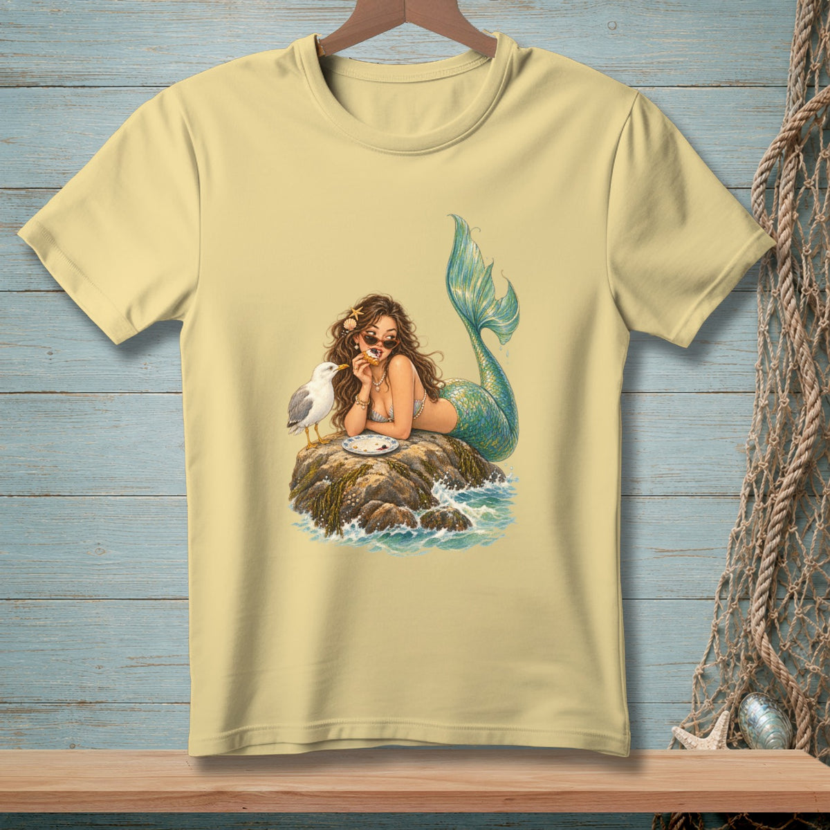 Mermaid and seagull sharing food on a rock in the ocean.