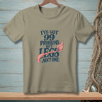 Tan t-shirt with "I've got 99 problems but legs ain't one" and mermaid tail.