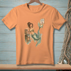 Orange t-shirt with a mermaid illustration and "Proper Footwear Required" sign.