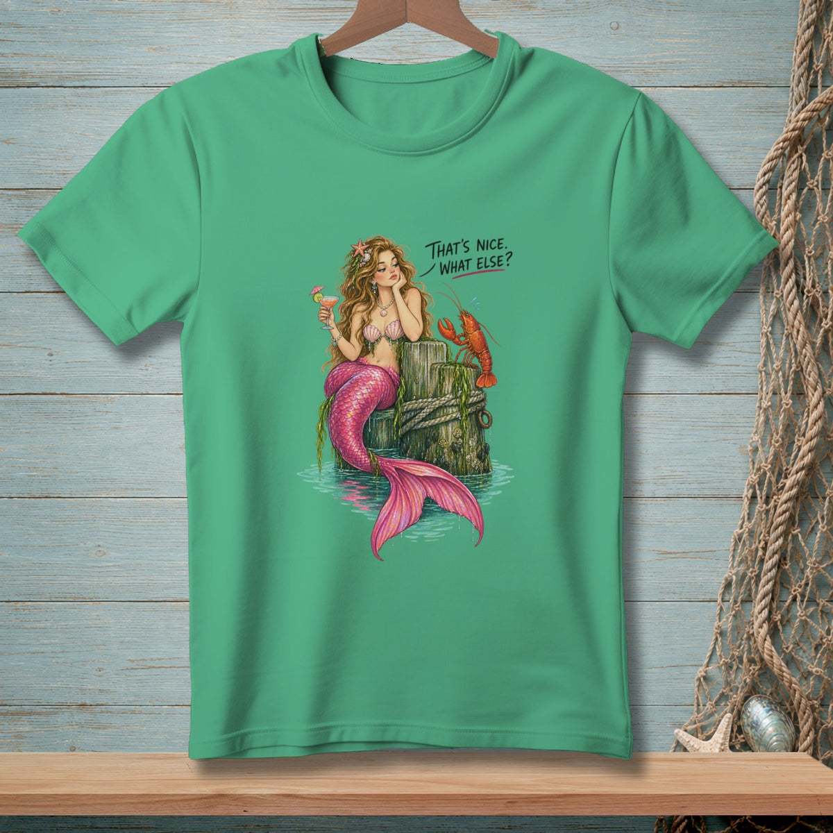 Mermaid with pink tail holding drink next to lobster, text "That's nice. What else?".