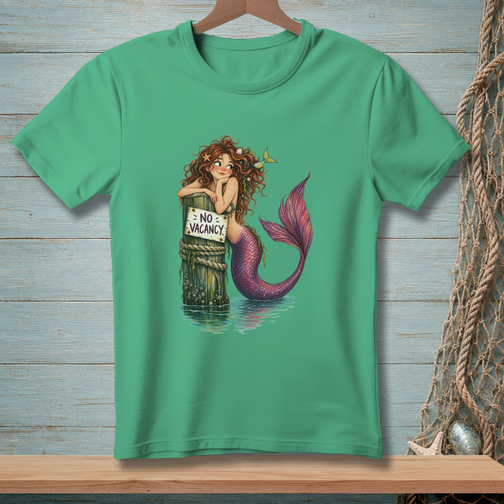Mermaid with purple tail leans on post with "No Vacancy" sign.